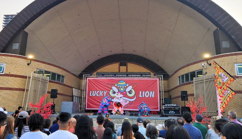 Prerformers gathering on stage to dance at Lucky Lion Night Market